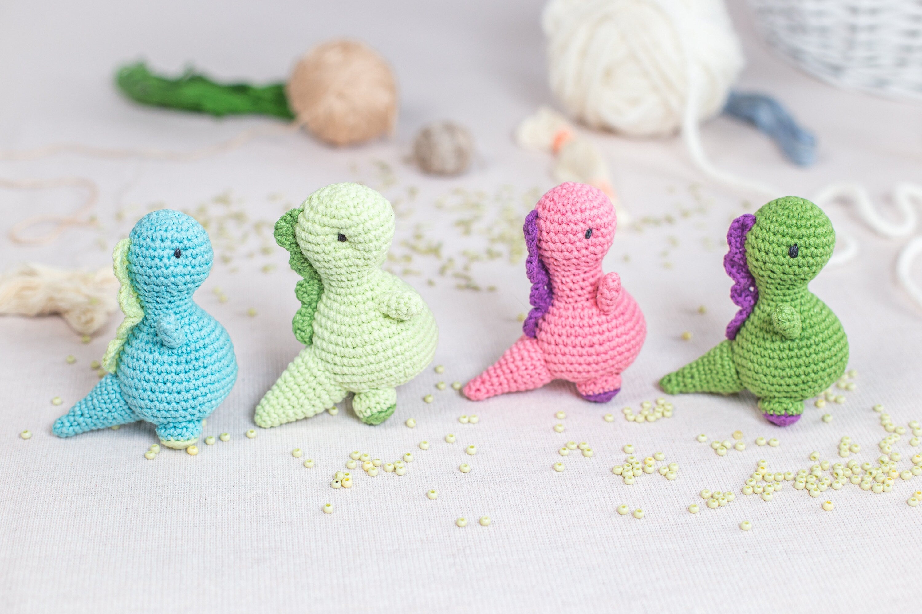 a group of crocheted toys sitting on top of a table